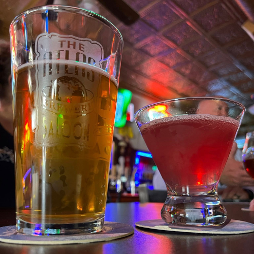 Craft beer and a red cocktail on a bar at Atlas Saloon Brewery in Downtown Excelsior Springs, Missouri