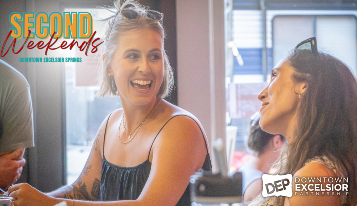 Two women laugh and chat inside a downtown business during Second Weekends in Downtown Excelsior Springs. The image features warm lighting and a lively social atmosphere, with the “Second Weekends” event logo displayed in the upper left corner and the Downtown Excelsior Partnership logo in the lower right.