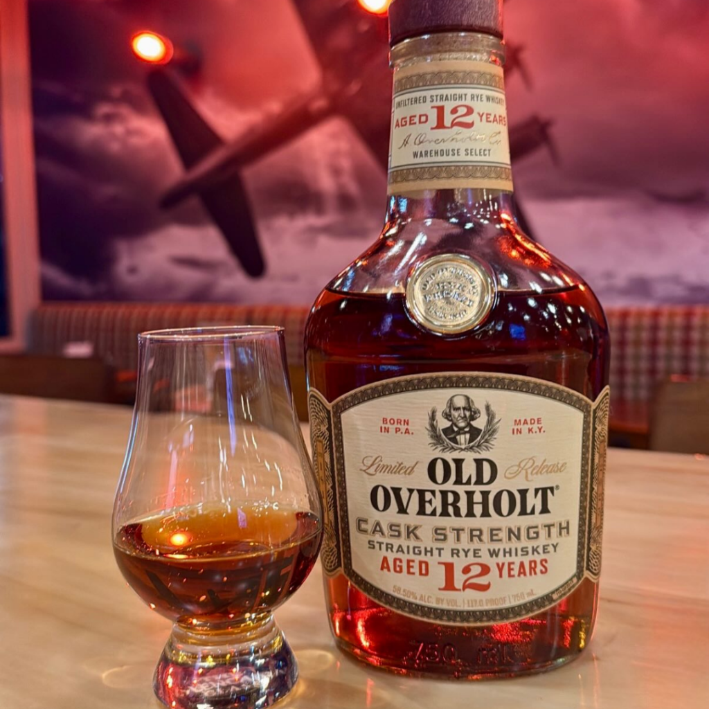 Glass of rye whiskey and bottle of Old Overholt 12-year cask strength at Warbird Whiskey in downtown Excelsior Springs.
