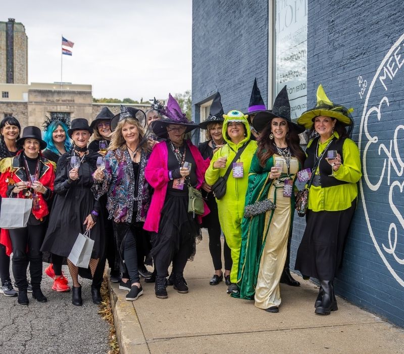 Costumed attendees gather while exploring Downtown Excelsior Springs during Witch Way to the Wine.