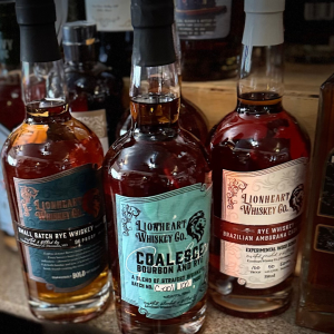 Lionheart Whiskey Co. small batch rye, Coalescence bourbon and rye blend, and Brazilian Amburana cask rye whiskey bottles on display at Willow Spring distillery in Excelsior Springs, Missouri.