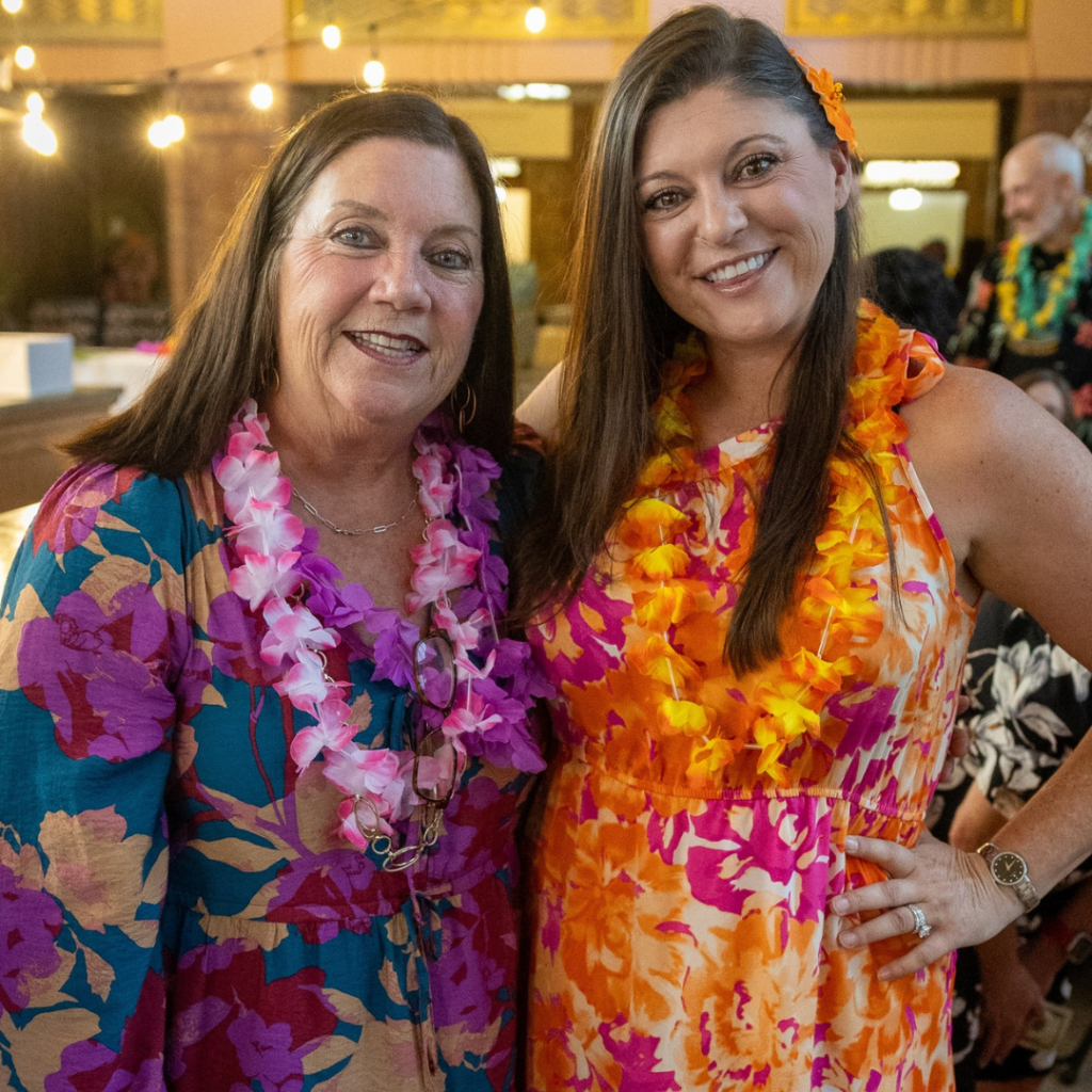 Carol Baxter and Lyndsey Baxter pose together at the Downtown Excelsior Partnership Annual Benefit Dinner, celebrating community revitalization and volunteer leadership.