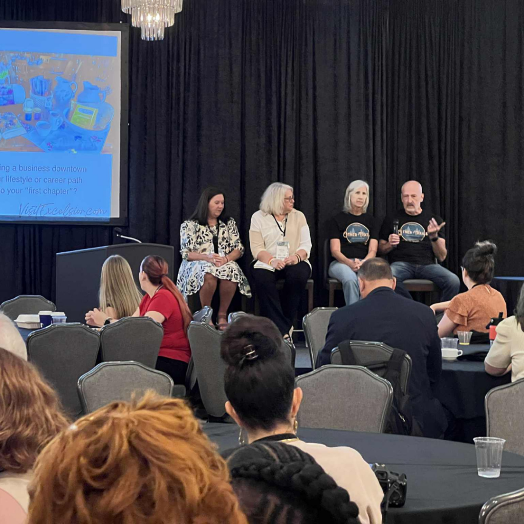 Small business owners participate in a panel discussion about entrepreneurship and business growth during the Connecting Entrepreneurial Communities Conference.