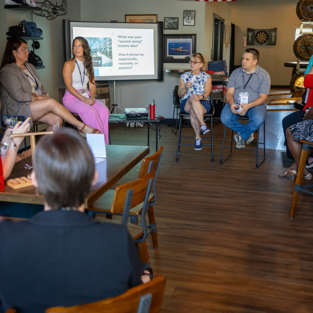 Panelists share insights on creating additional income streams for small businesses during a breakout session at the Connecting Entrepreneurial Communities Conference.