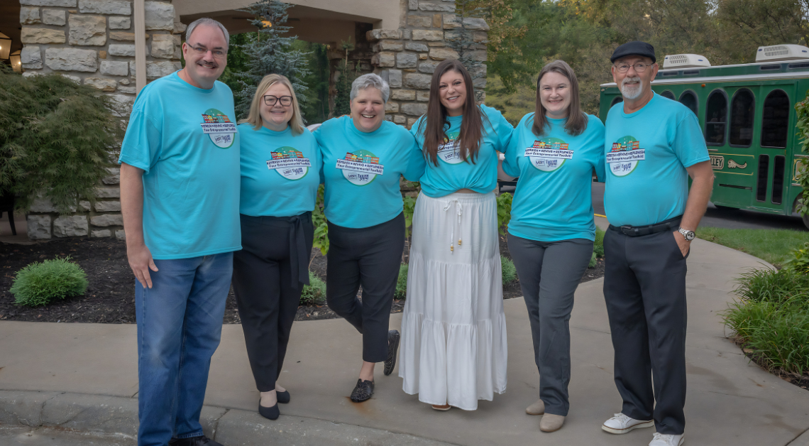Members of the Excelsior Springs planning team gather outside The Elms Hotel & Spa while hosting the Connecting Entrepreneurial Communities Conference, showcasing collaboration between local organizations and community leaders.