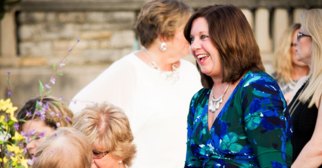 Carol Baxter smiles while attending a Downtown Excelsior Partnership event. A longtime volunteer, business owner, and advocate, she has dedicated more than 15 years to revitalizing Downtown Excelsior Springs.