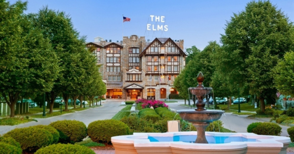 The historic Elms Hotel & Spa stands at the entrance to Excelsior Springs, Missouri, serving as a major tourism destination and economic driver for the downtown district.