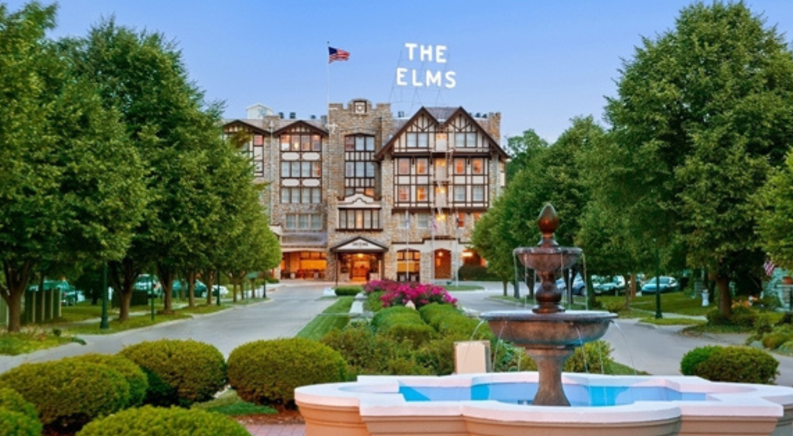 The historic Elms Hotel & Spa stands at the entrance to Excelsior Springs, Missouri, serving as a major tourism destination and economic driver for the downtown district.