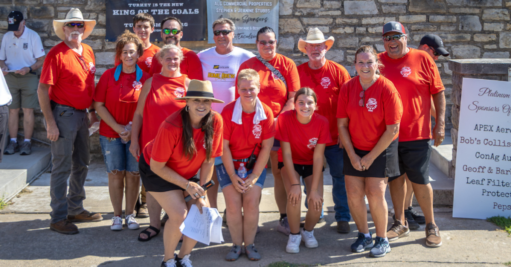 Volunteers gather during the BBQ & Fly-In on the River in Downtown Excelsior Springs.