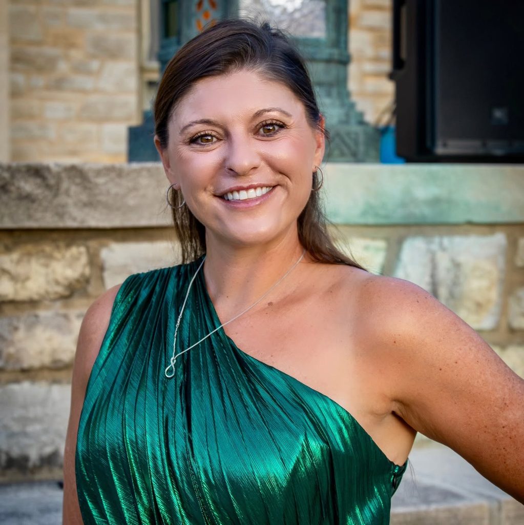 Lyndsey Baxter, Executive Director of Downtown Excelsior Partnership, smiles for a portrait.